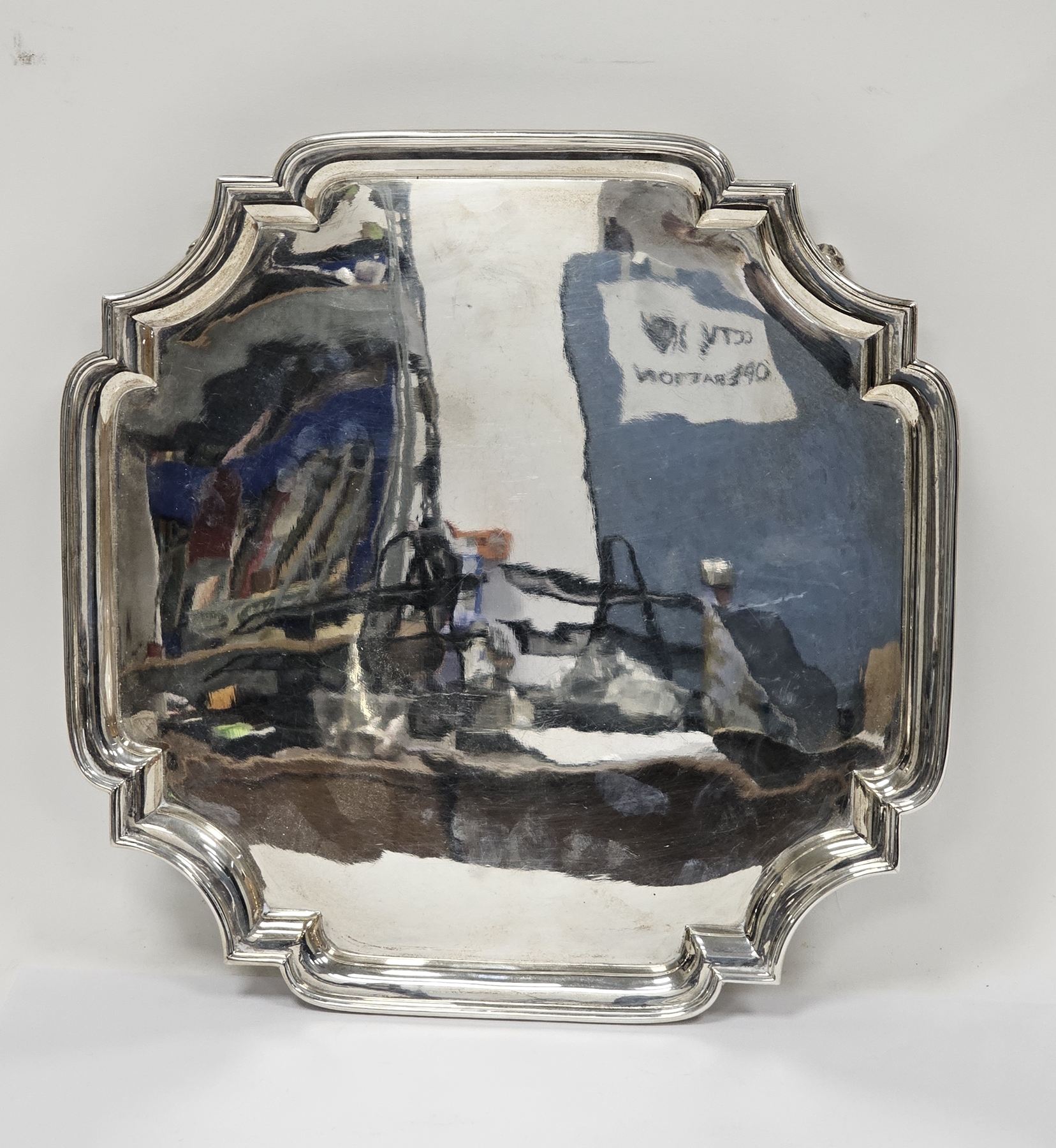 George V silver salver, Sheffield 1926, Mappin & Webb, of square form with shaped canted corners,