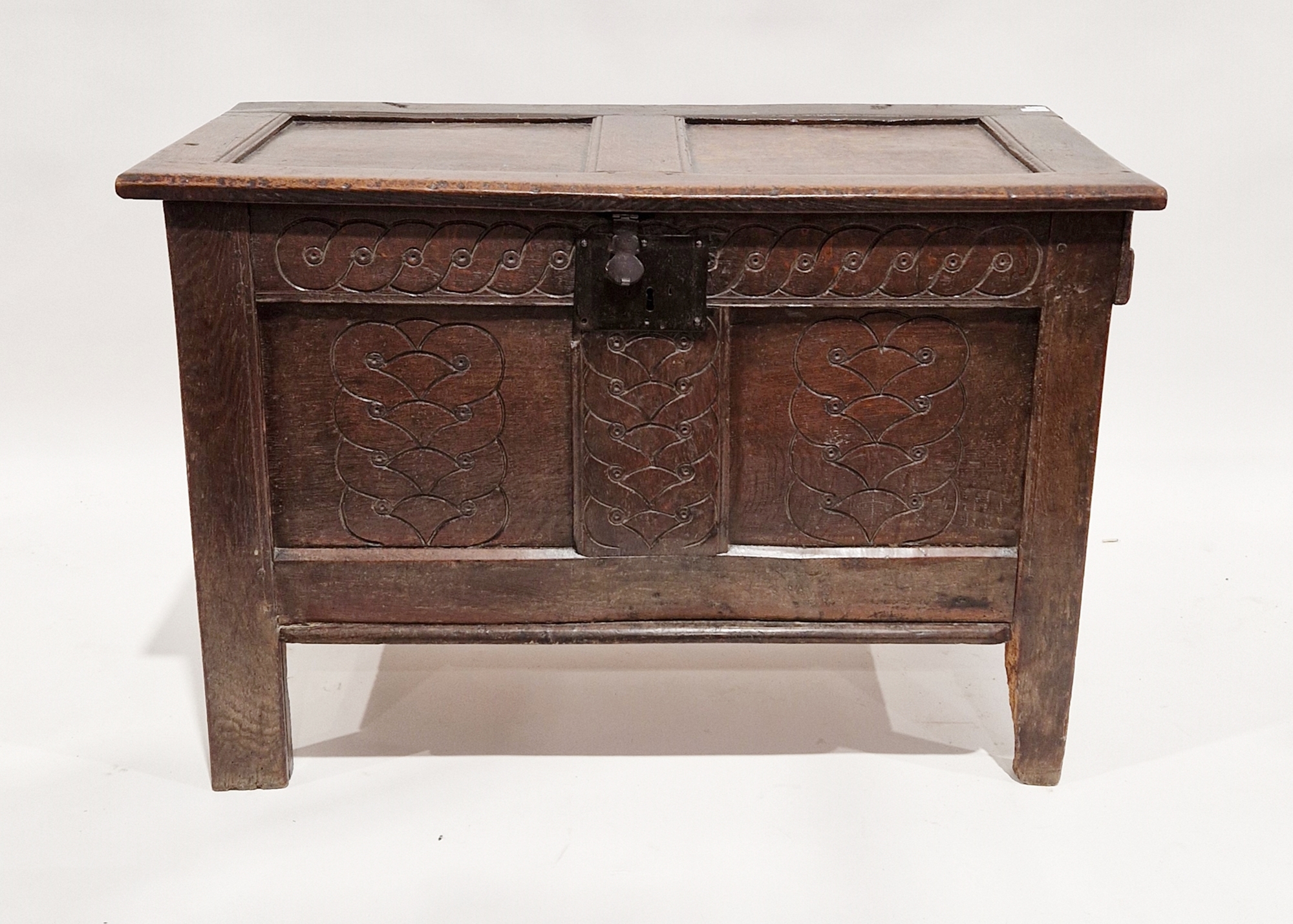 18th century oak coffer, the hinged two panel lid opening to an empty space, the two panel front
