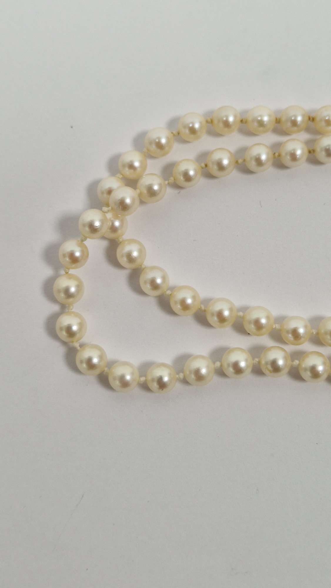 Double string of cultured pearls with 9ct gold and garnet set clasp, with star design, cased - Image 5 of 8