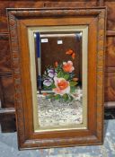 Late 19th/early 20th century oak framed mirror, the bevelled plate with a cut and painted design