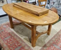 Large 20th century oval oak extending dining room table raised on substantial square chamfered