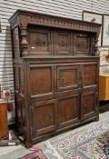 17th/18th century English oak court cupboard, the moulded cornice with thumbnail carving above a