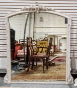 Large 19th century overmantel mirror, the arched wooden frame later painted white and with carved