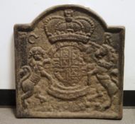 Large cast iron fireback depicting coat of arms of Charles I, measuring approx. 56cm high x 53cm