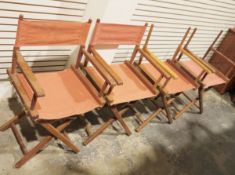 Four folding teak chairs with orange canvas seats (4)