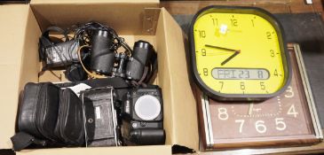 Seiko faux wood wall clock, a Life Max wall clock, a Nikon N80 camera, a pair of Kowa binoculars and