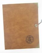 Collector's folder containing 11 sheets of various denominations, including silver crowns (poor