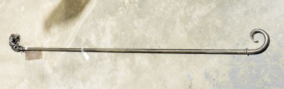 Wrought iron curtain pole with scroll ends