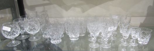 Collection of cut glass drinking glasses including a set of seven Royal Doulton tumblers and other