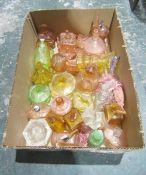 32 early 20th century clear and coloured moulded glass perfume bottles, dressing jars, atomisers,