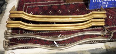 Pair of 19th century giltwood curtain pelmets, 155cm long and a silvered pair of wooden curtain