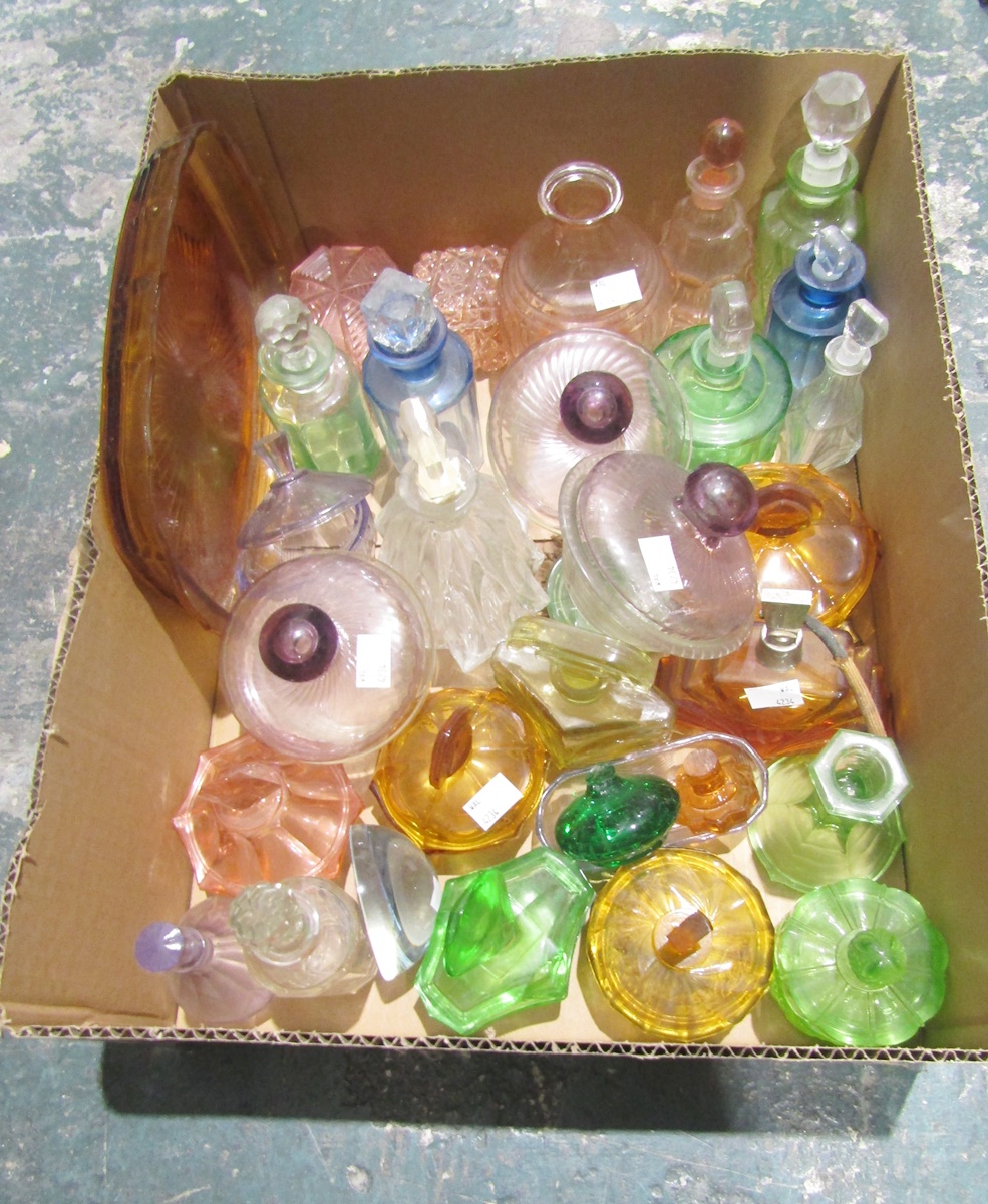 Collection of approx. 29 early 20th century clear and moulded coloured glass perfume bottles,