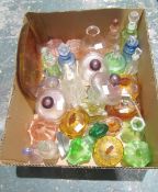 Collection of approx. 29 early 20th century clear and moulded coloured glass perfume bottles,