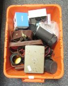 Collection of camera accessories and equipment including flashes and lenses and a Sima D8 cine