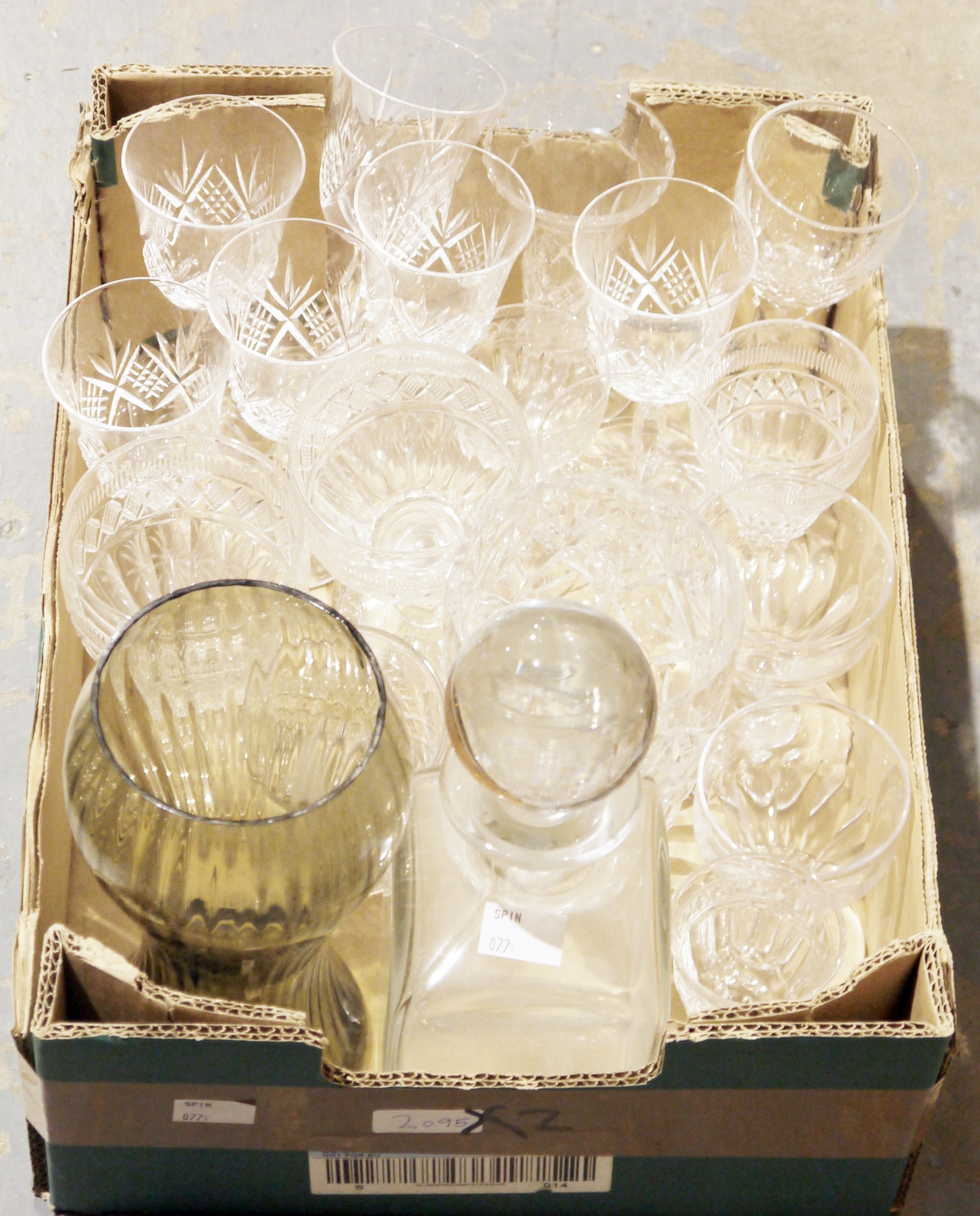 Collection of glassware including cut glass drinking glasses, uranium glass items, a clear glass