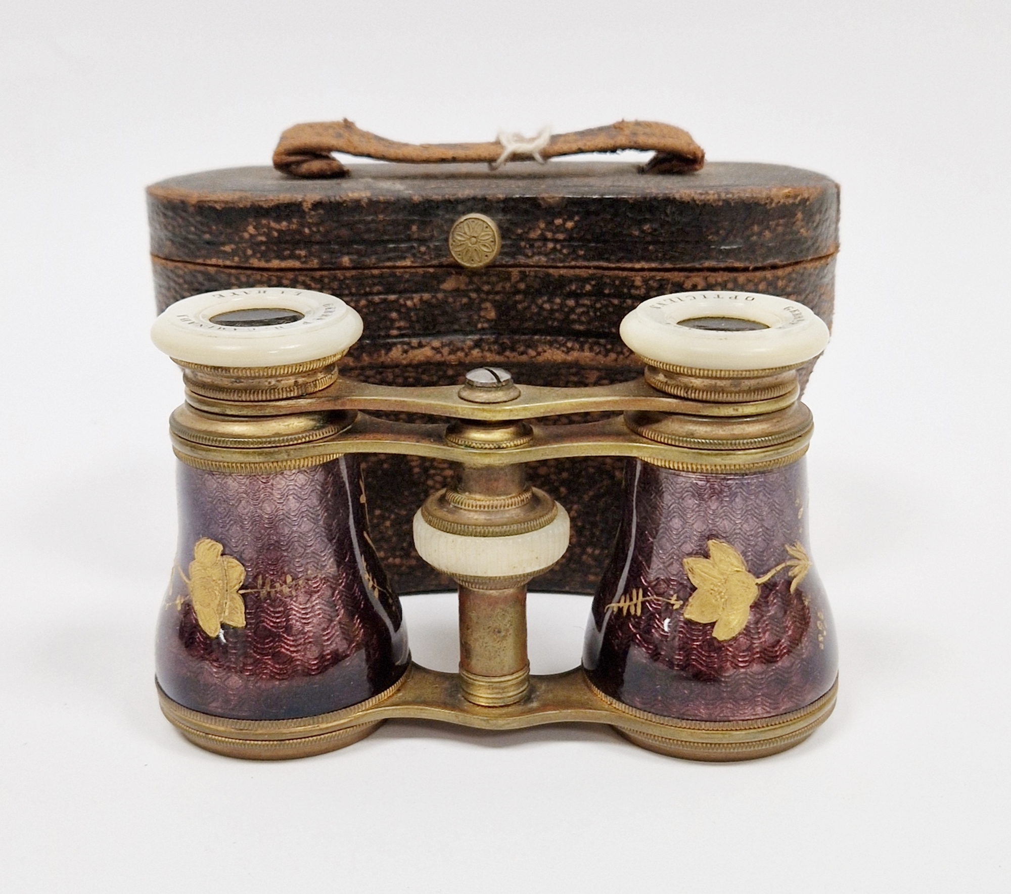 Pair of late 19th century French gilt metal opera glasses, the barrels with enamel decoration of