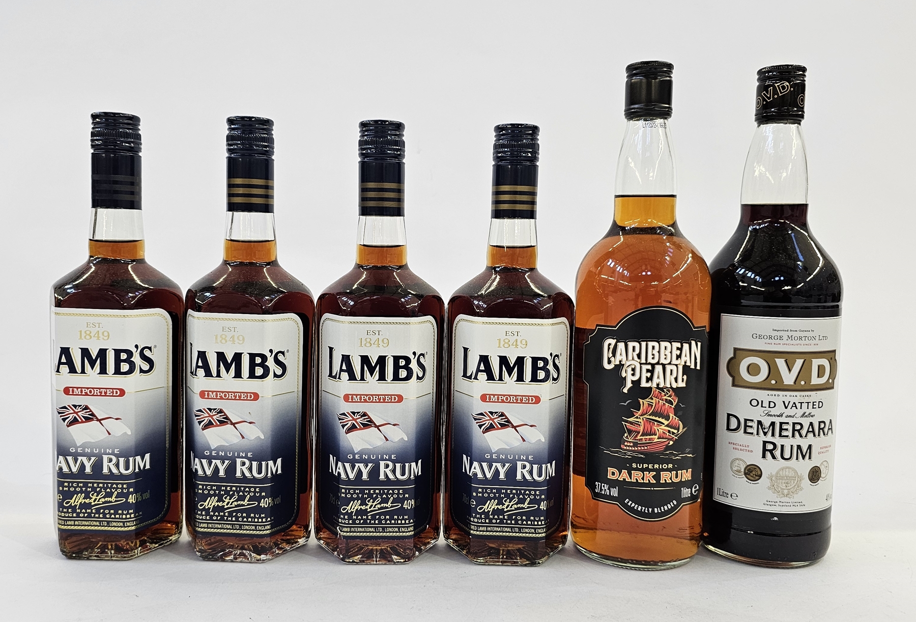 Four bottles of Lamb's Imported Genuine Navy Rum, 70cl 40% vol, together with a bottle of