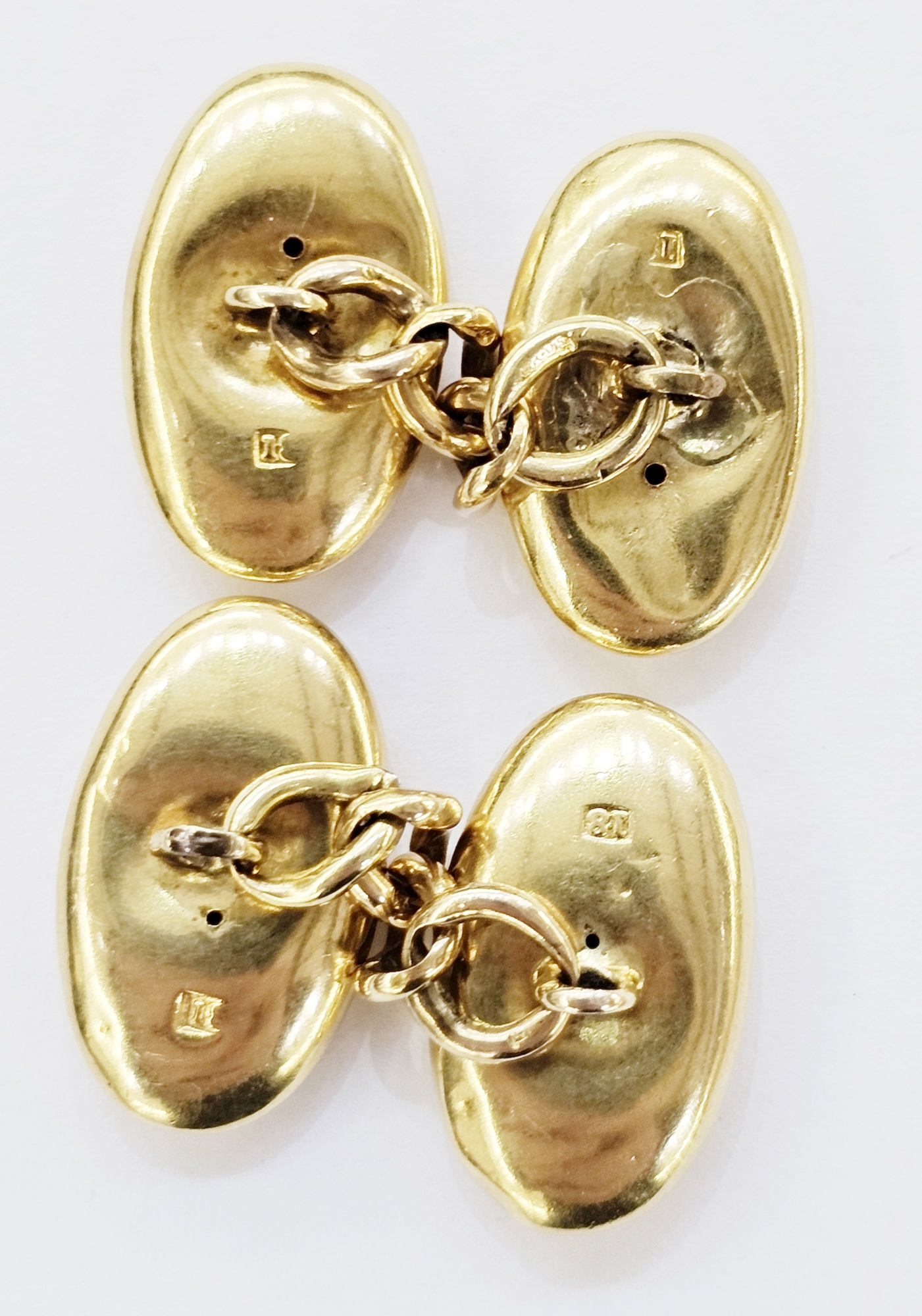 Pair of gold cufflinks with polished oval form with chain links marked 18 to the heads and 15ct to - Image 2 of 2