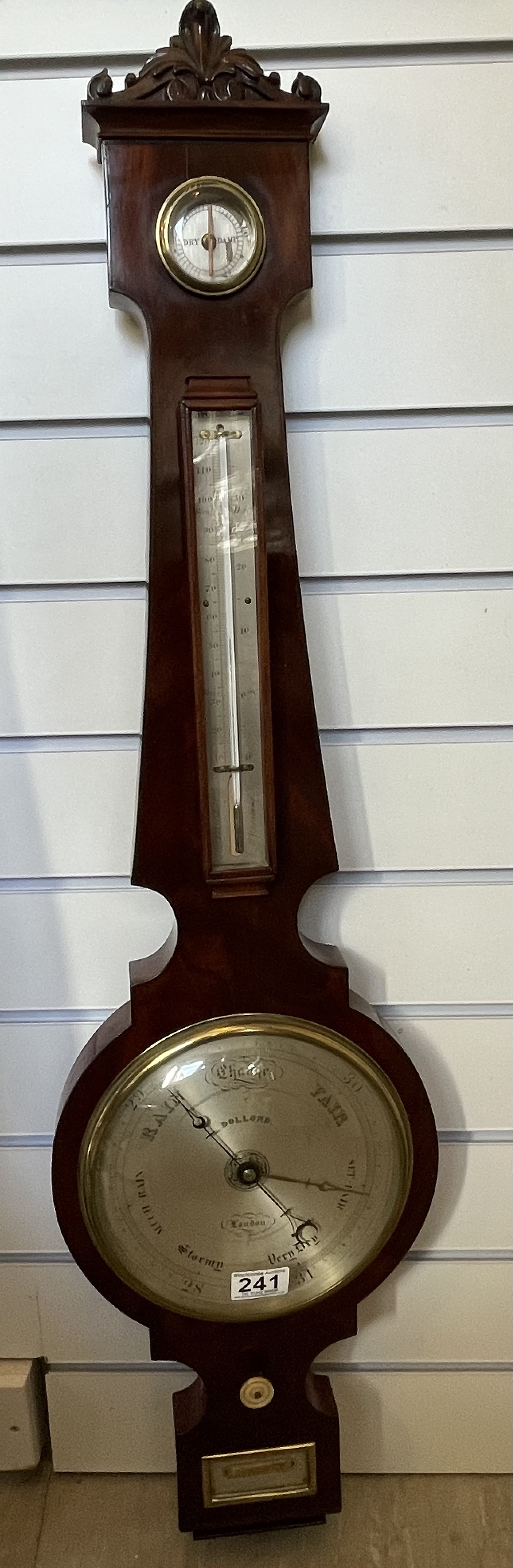 A Victorian wheel barometer by "Dolland", London
