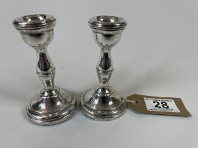 A Pair Of Silver Candlesticks