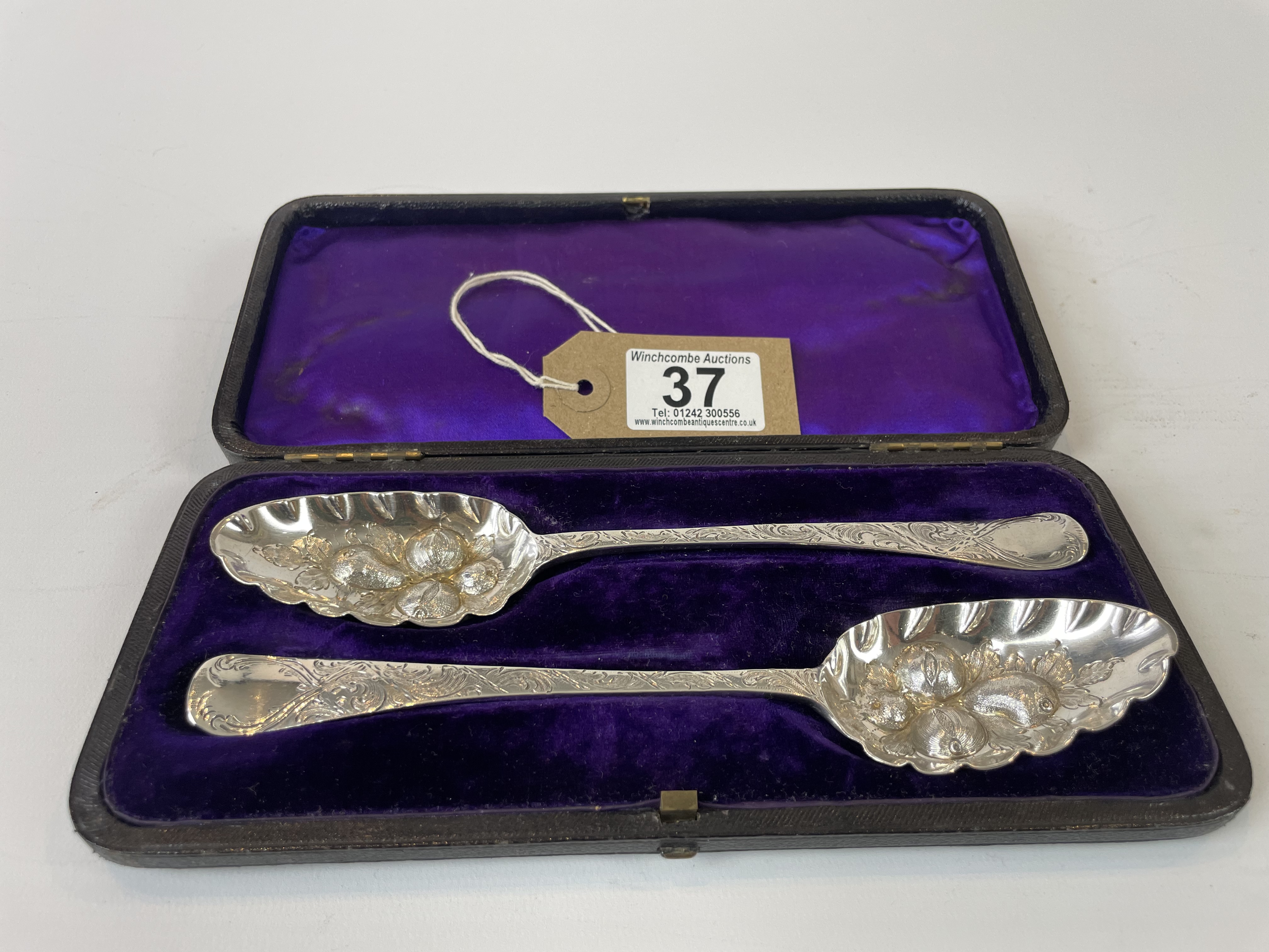 pair of solid silver berry spoons dated 1779