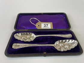 pair of solid silver berry spoons dated 1779