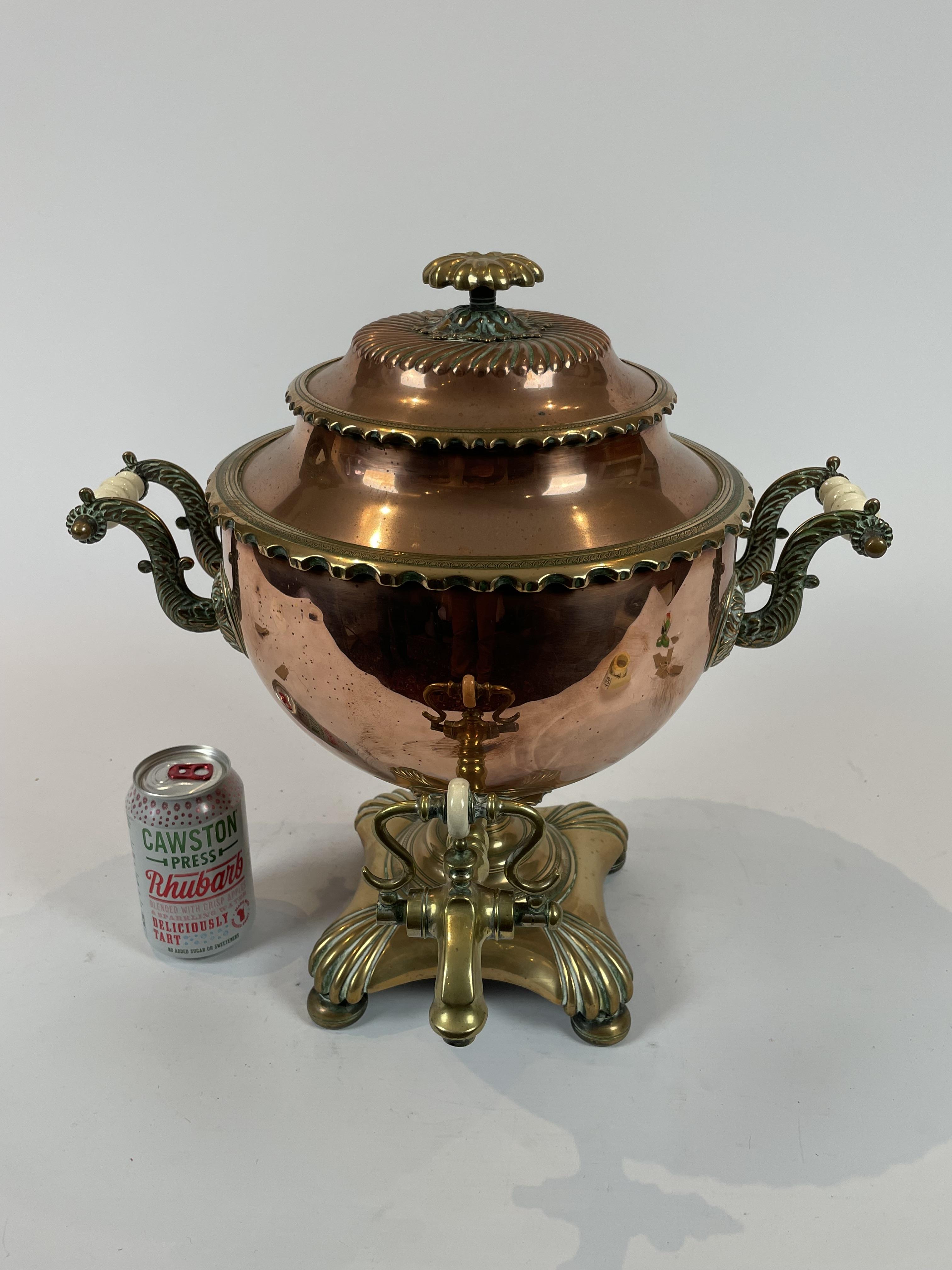 A Large Copper And Brass Samovar With Porcelain Handles