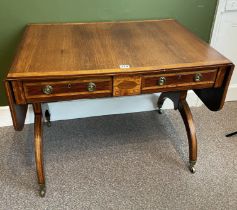 A Regency Sofa Table With Two Drawers On Brass Casters