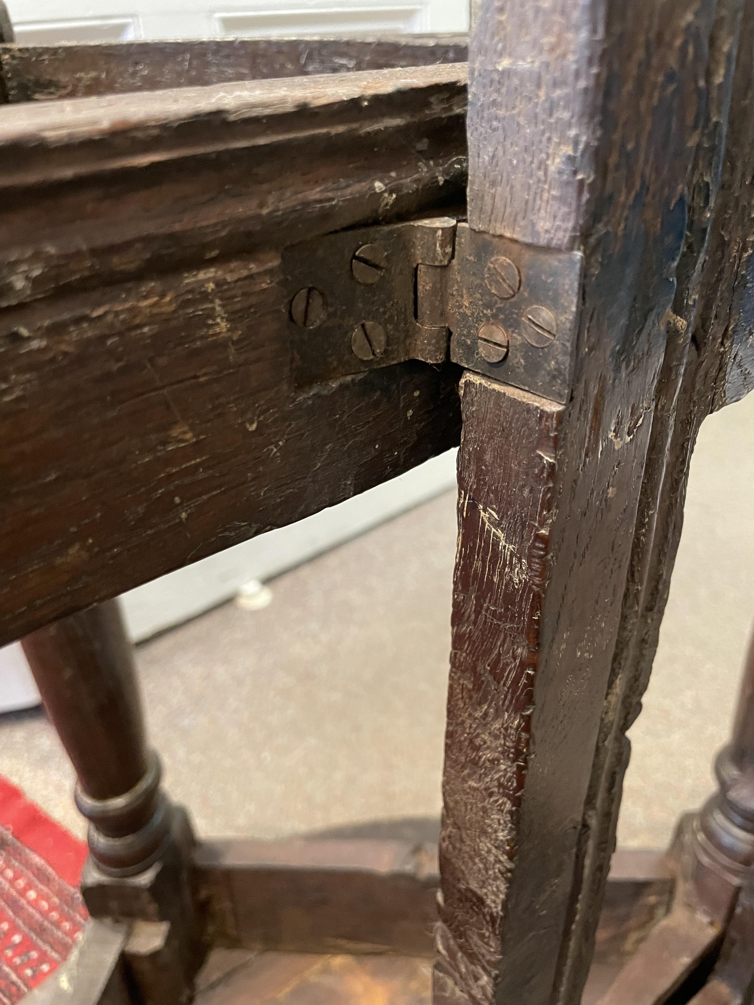 A 17th century oak credence table with a drop leaf side. - Image 7 of 8