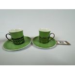 A Pair Of Shelley China Cups and Saucers with Silver Surround and Handle