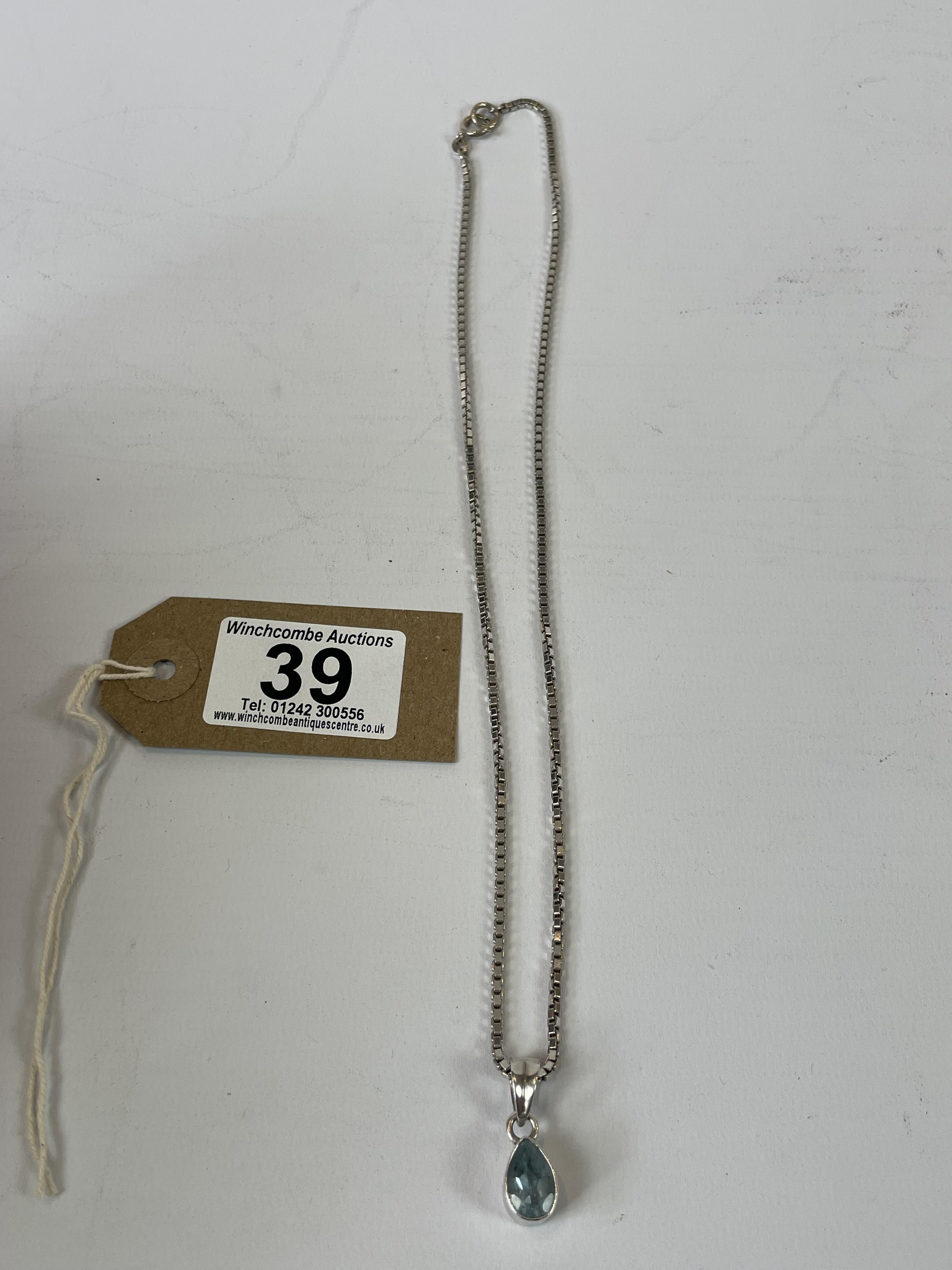 heavy silver chain necklace with pendant in silver casing