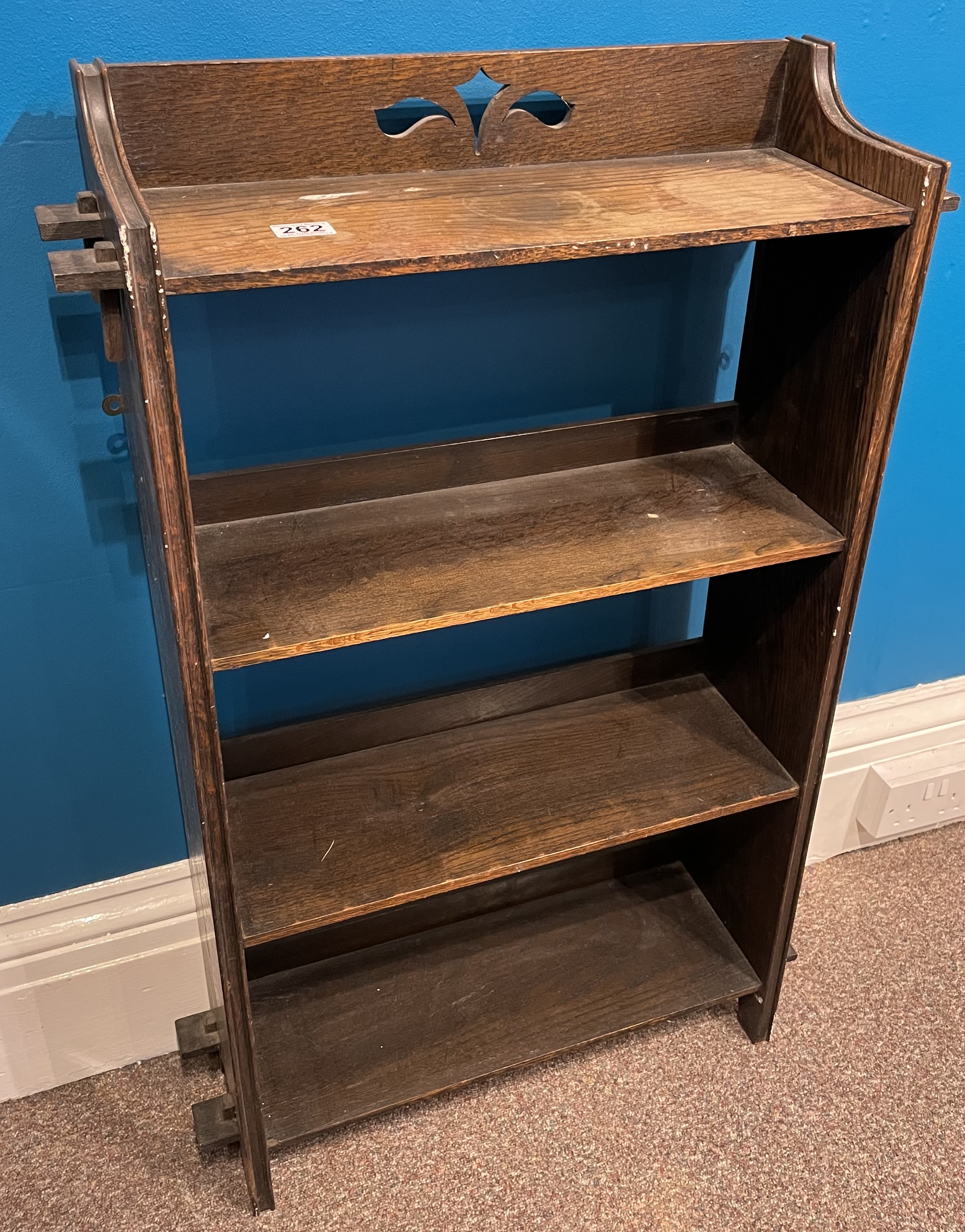 A four tier oak bookcase with peg joints to the side