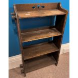 A four tier oak bookcase with peg joints to the side