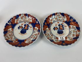 2 Imari red, white and blue plates with floral central motif