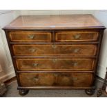 A Walnut Chest Of Drawers On Bun Feet