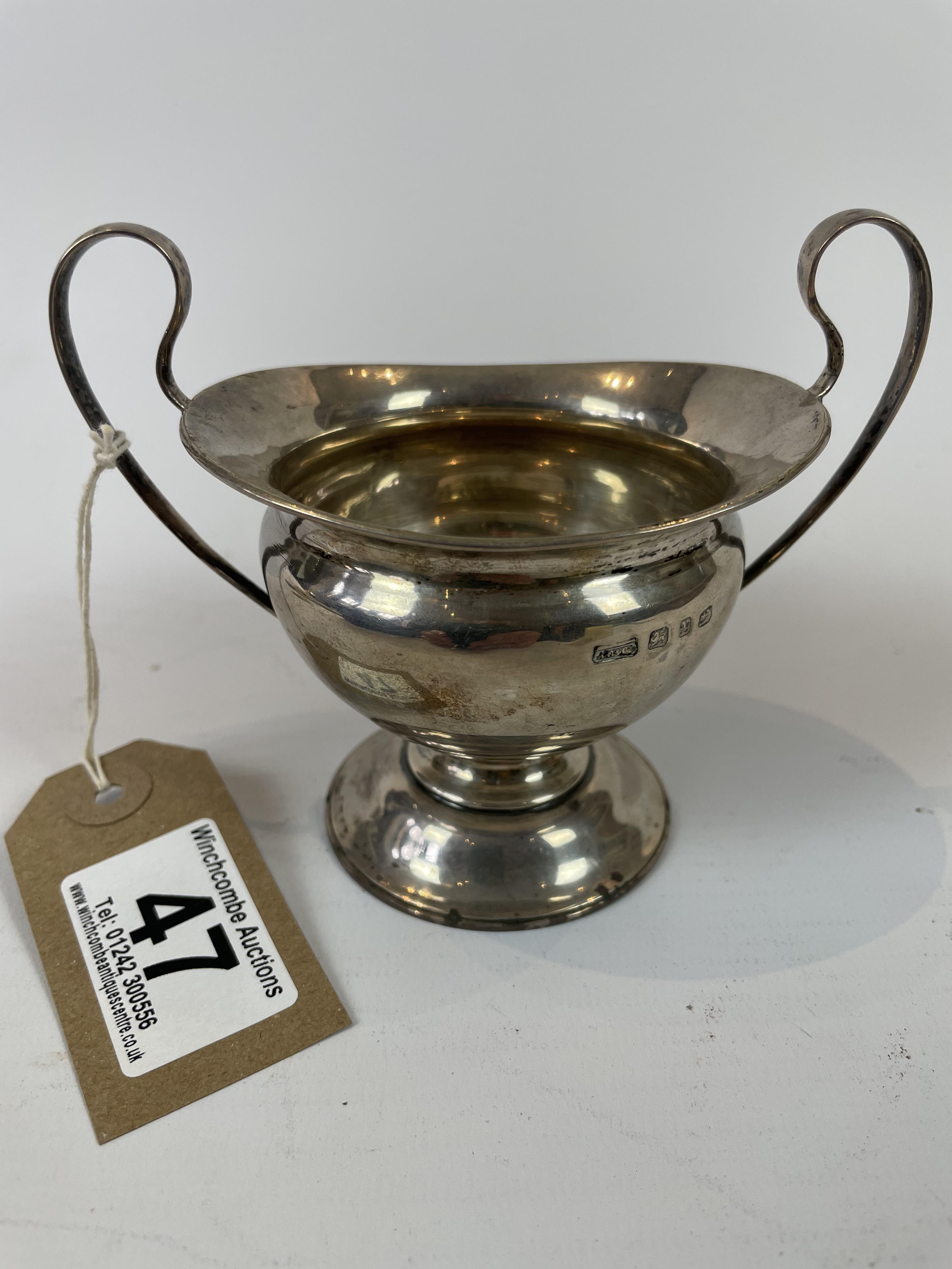 Twin handled solid silver trophy cup dated Birmingham 1897