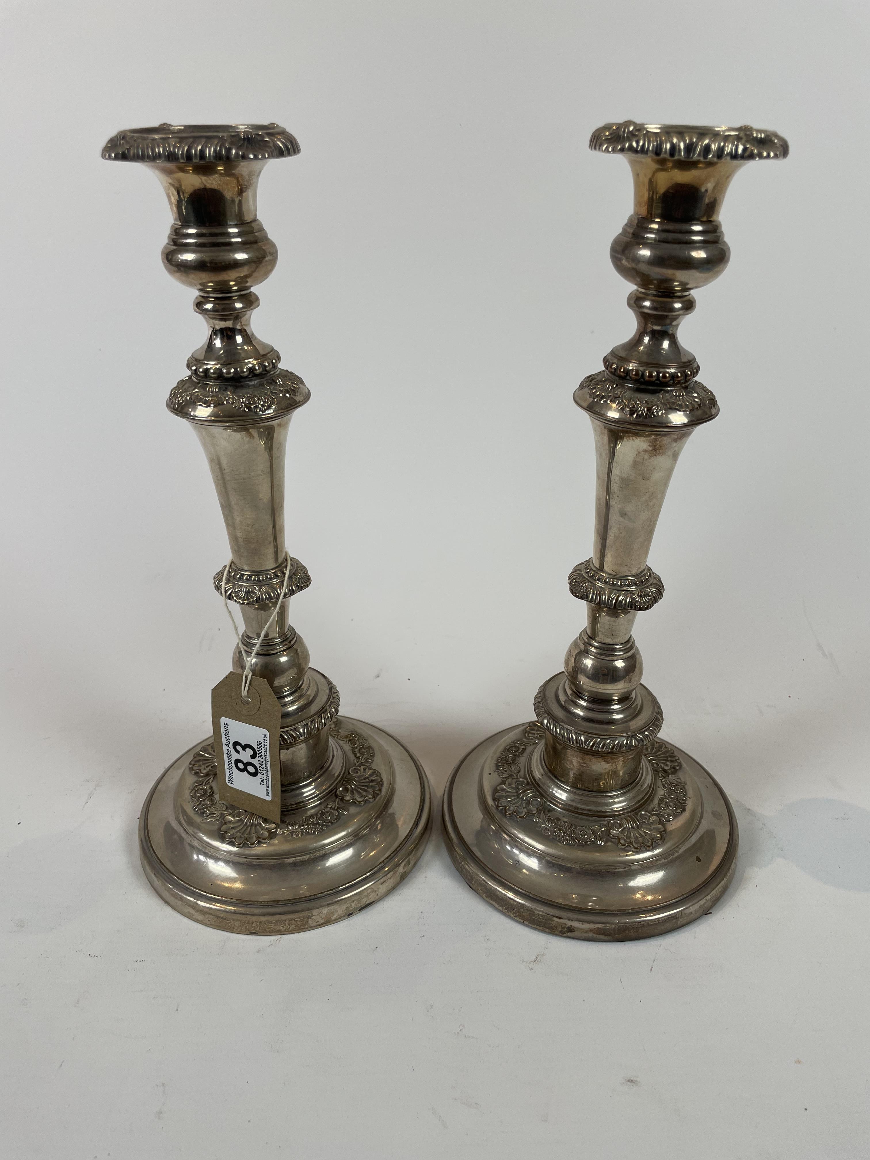 A Pair Of Large Silver Plated Candlesticks