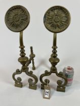 A Large Pair Of Brass Firedogs
