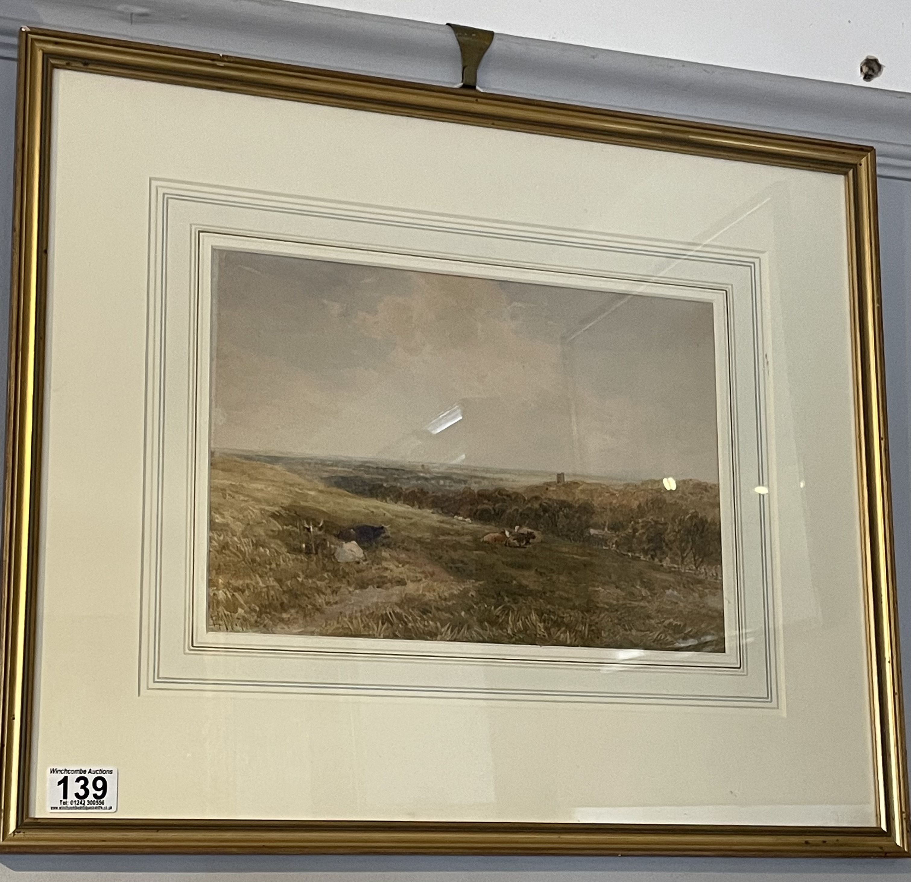 A framed watercolour by Edmond Morison Wimperis, dated 1879 depicting cattle in a pasture