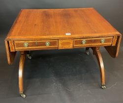 A Regency Sofa Table With Two Drawers On Brass Casters