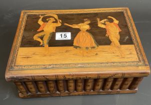 Treen box with inlaid dancers and hidden compartment beneath.