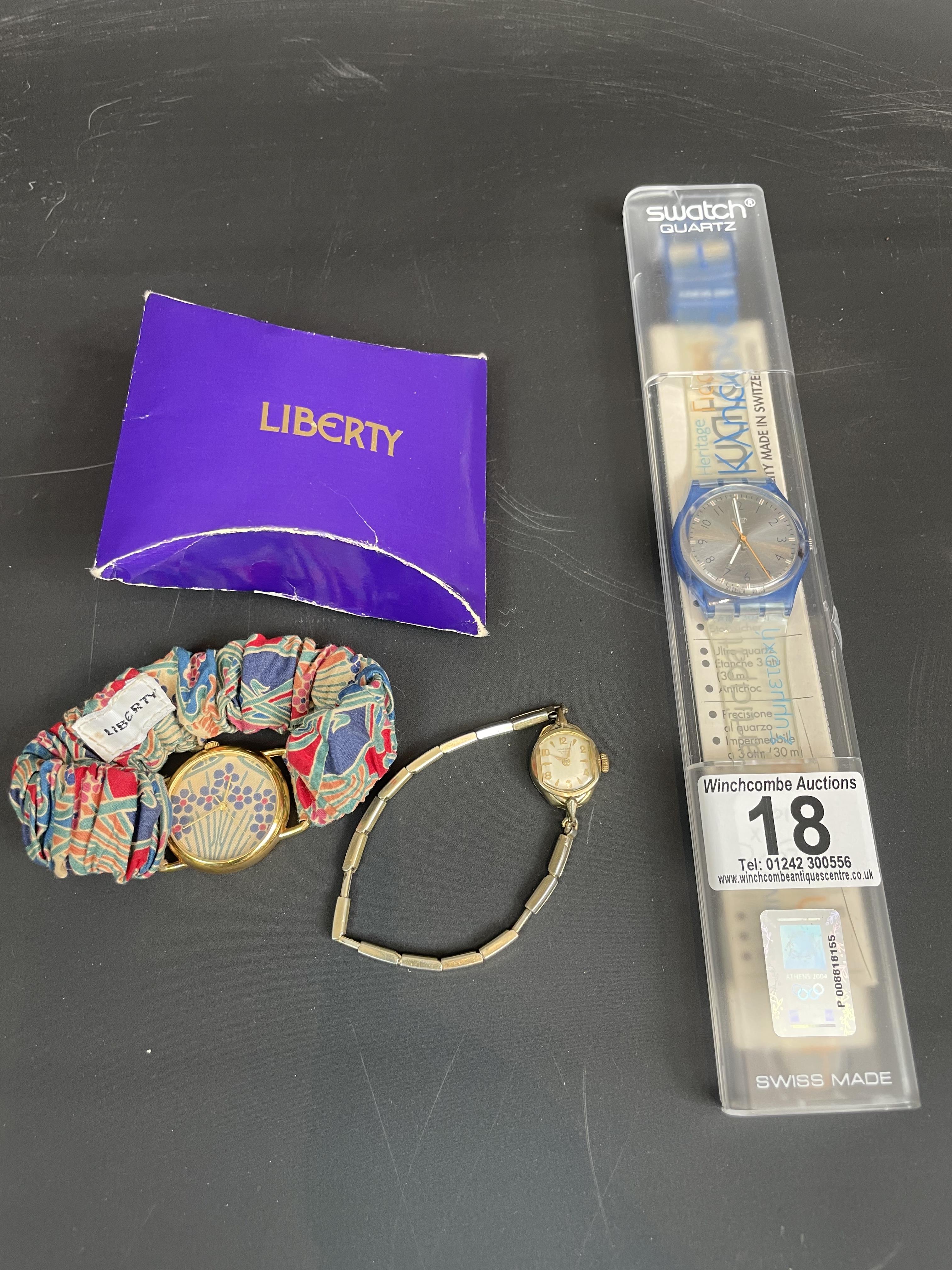 A collection of three watches including one by Liberty