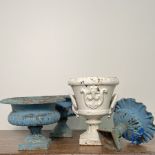 4 cast iron garden vases.