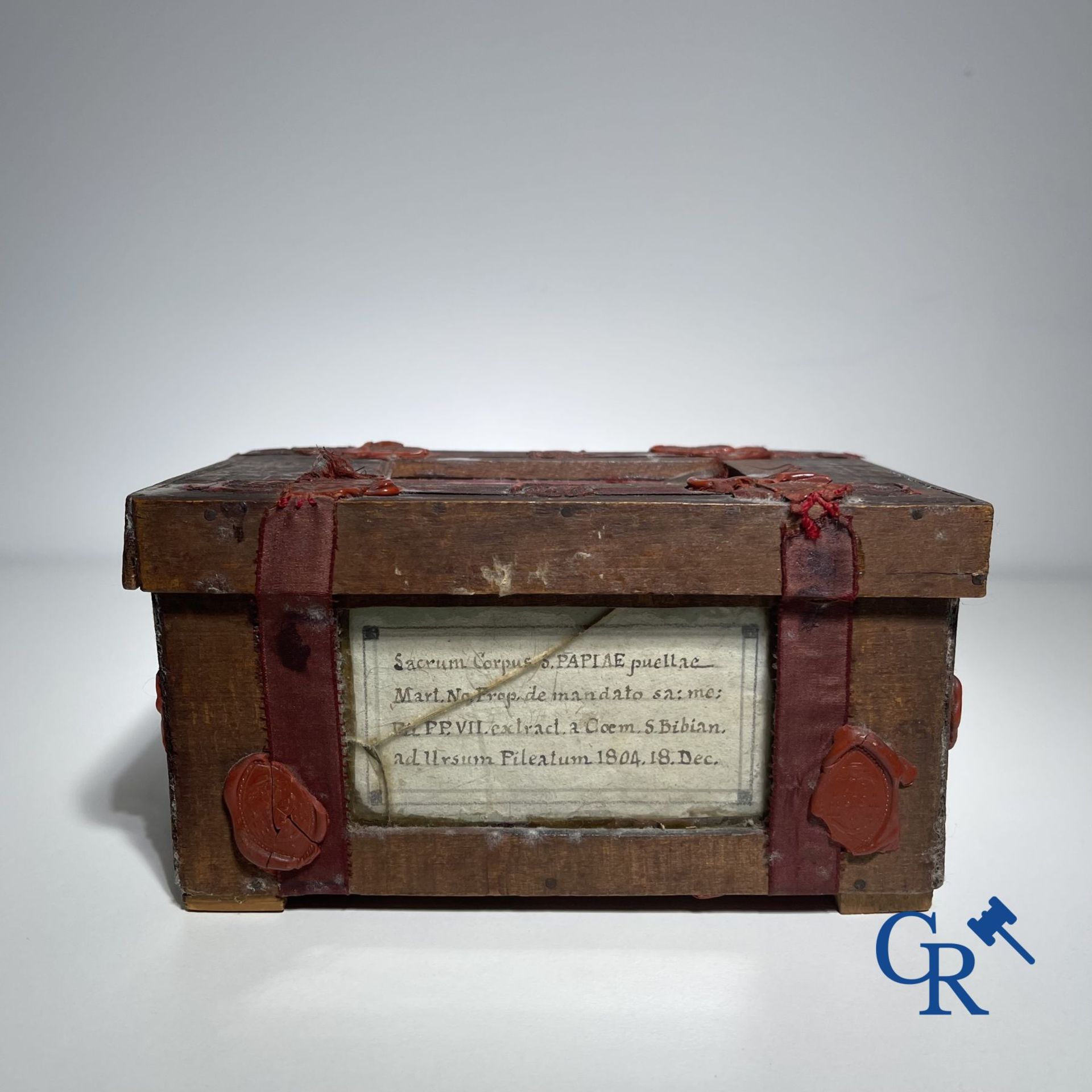 An antique wooden reliquary sealed with wax seals. Early 19th century.