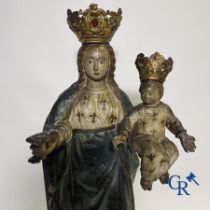 Wooden polychrome Baroque sculpture of Mary with child. The Crown inlaid with an amber-like rock.
