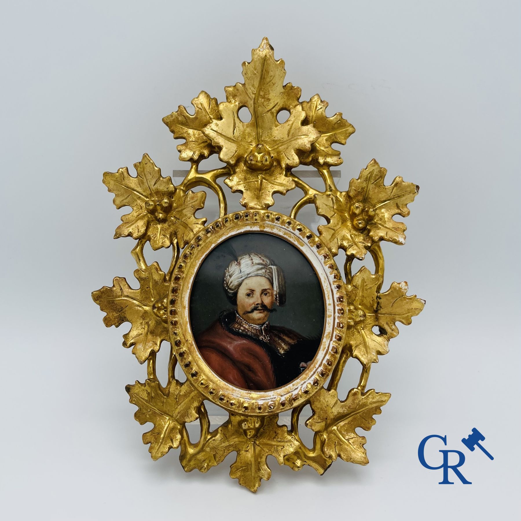 Miniature portrait in a gilded wood-carved frame. 19th century.