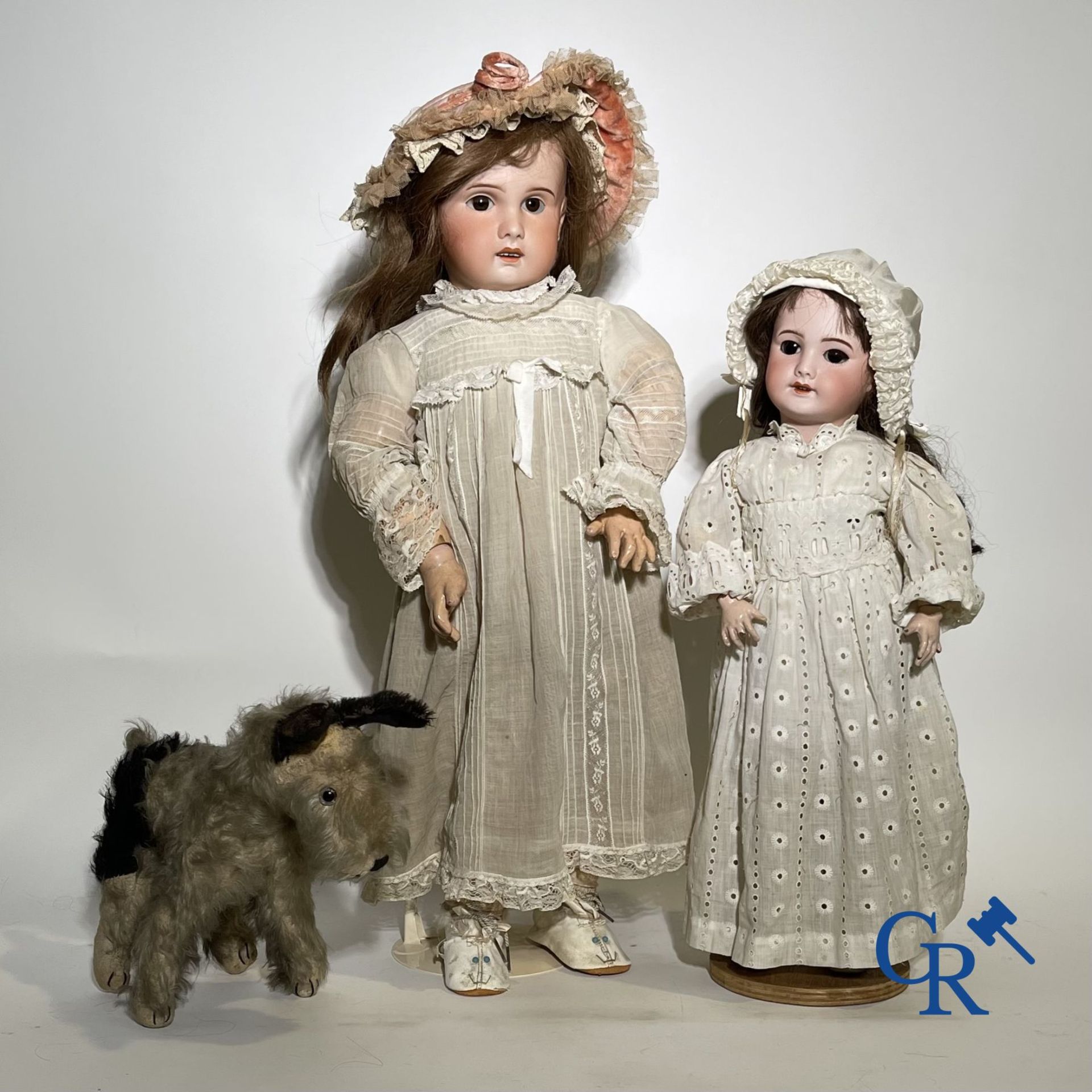 Toys: antique dolls: 2 dolls with porcelain head and a dog.