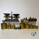 A various lot of antique calibration weights and a calibrated scale. 18th-19th century.