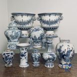 Delft: 11 pieces of blue and white faience with different décors. 17th - 18th century.
