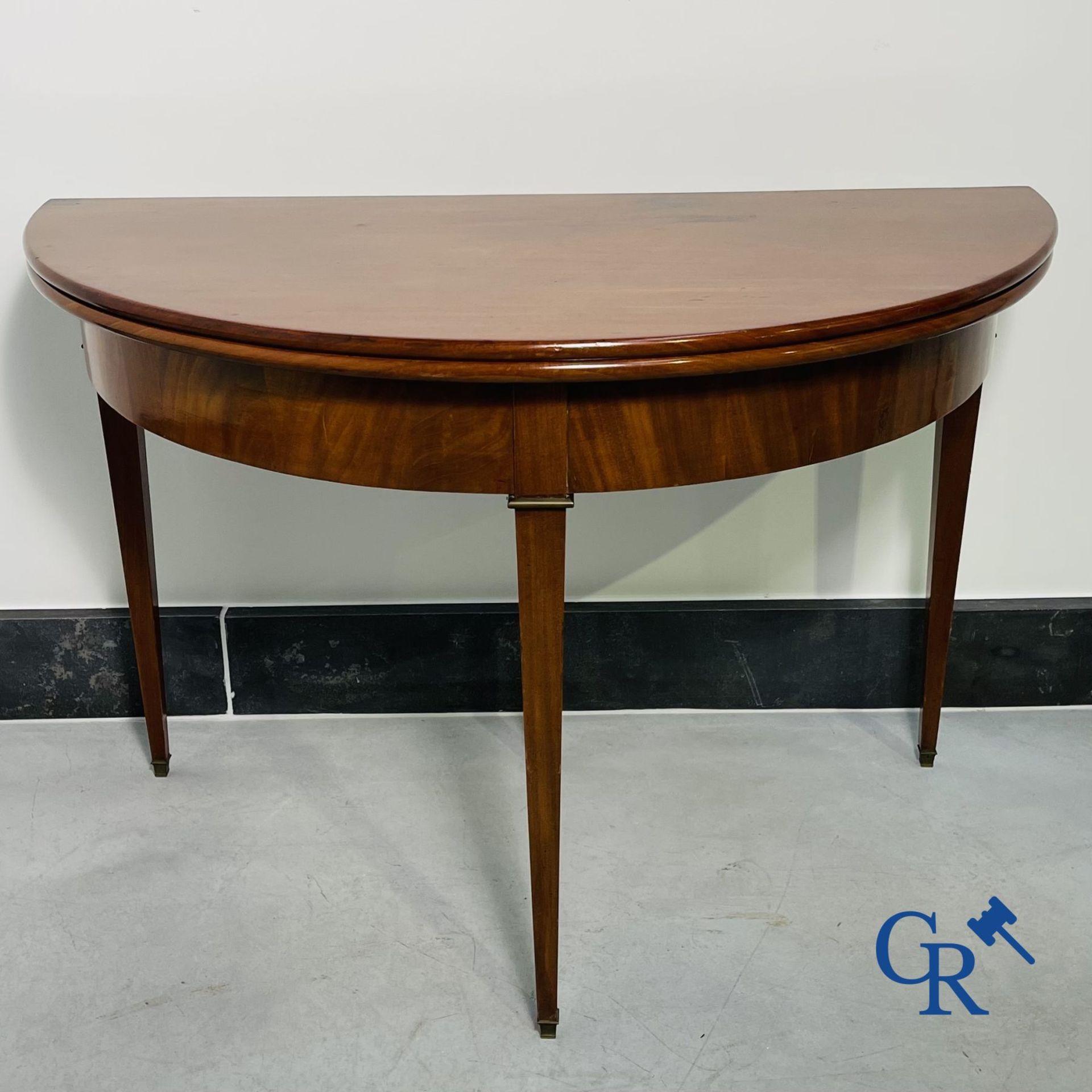 Furniture: fold-out crescent-shaped mahogany table. Directoire period.